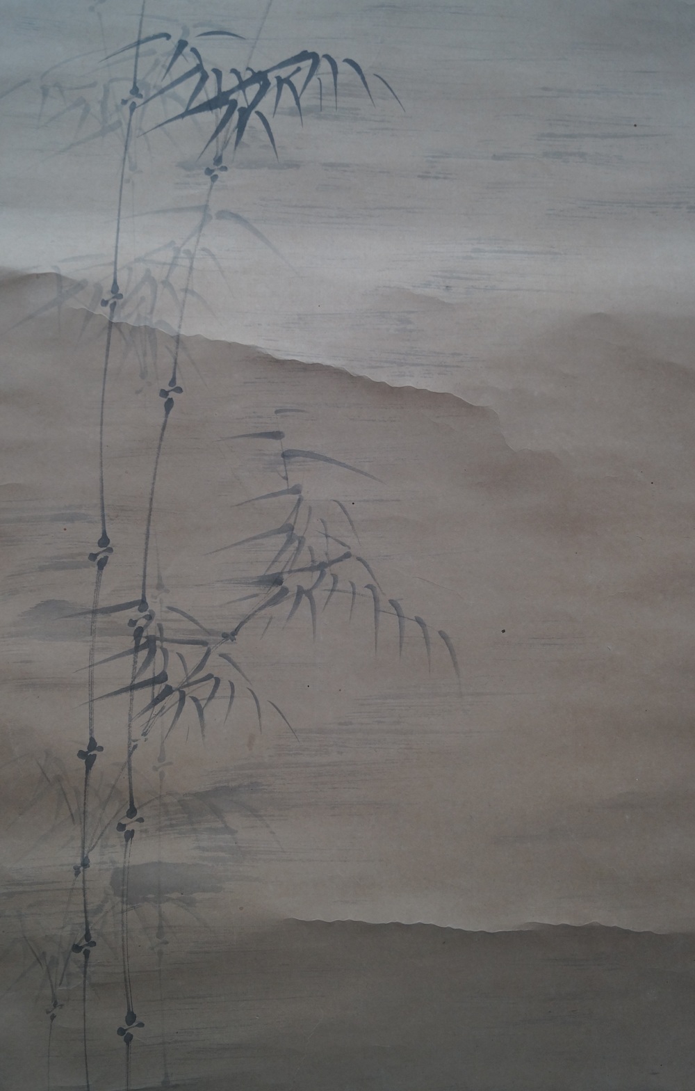 Bamboo and full moon close-up of the bamboo branches against the mountain landscape in the background landscape close-up