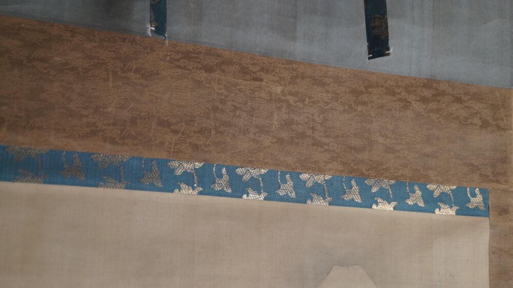 Detail View of the Brown Pine-Pattern Silk Mounting with Blue Crane Brocade Band of the Kakemono Mount Fuji in Cloud-Wreathed Heights