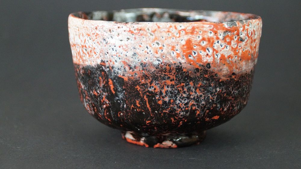 Further view of the chawan tea bowl made of Raku ware with high-contrast glaze