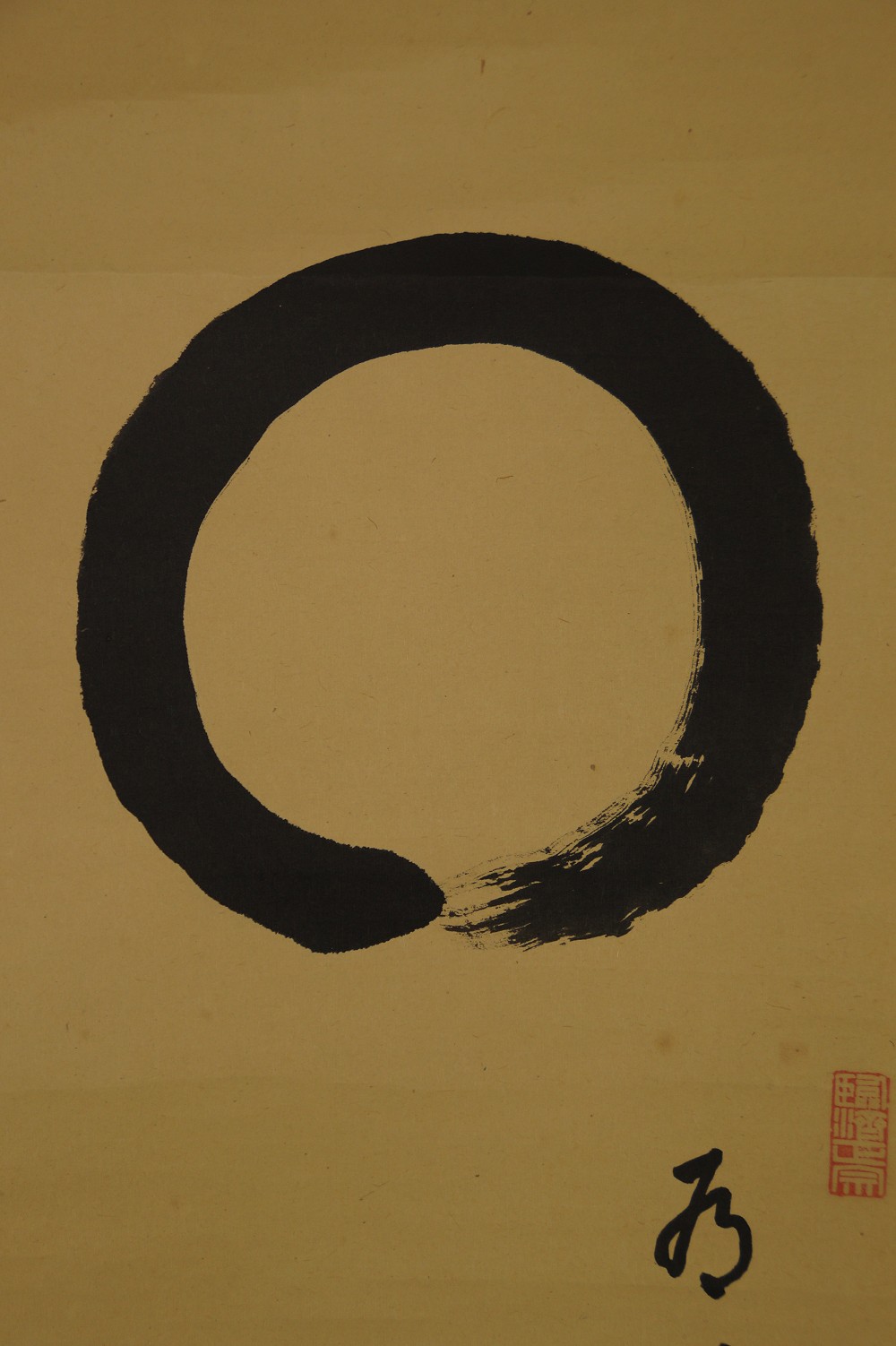 Close-up of the enso circle with small character and red seal