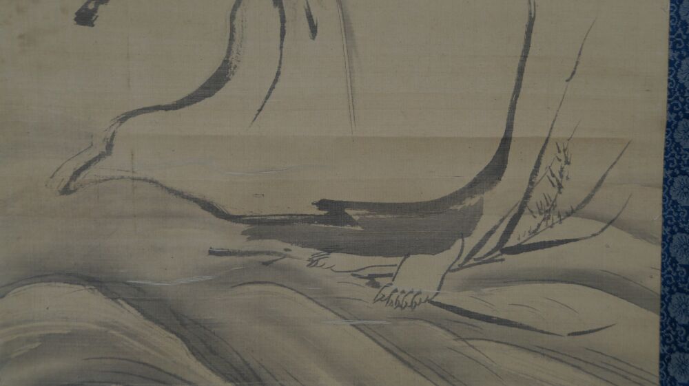 Close-up of the washed foot and hem of the robe above the waves in the kakemono Bodhidharma on His Way
