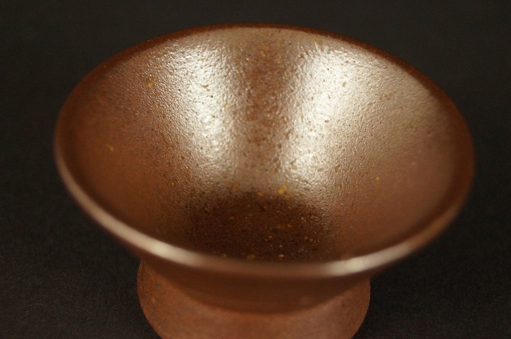 Bizen ware sake bottle with guinomi cups Guinomi interior close-up