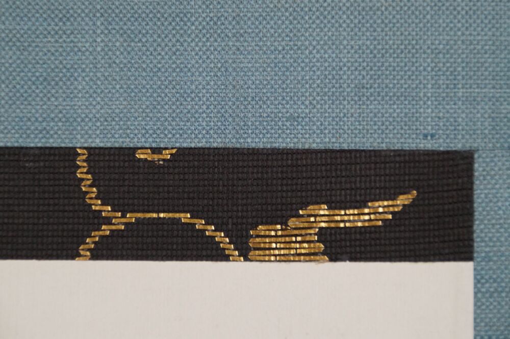 Detail view of the turquoise silk mounting with black-and-gold brocade border of the Kakemono Calligraphy Snow