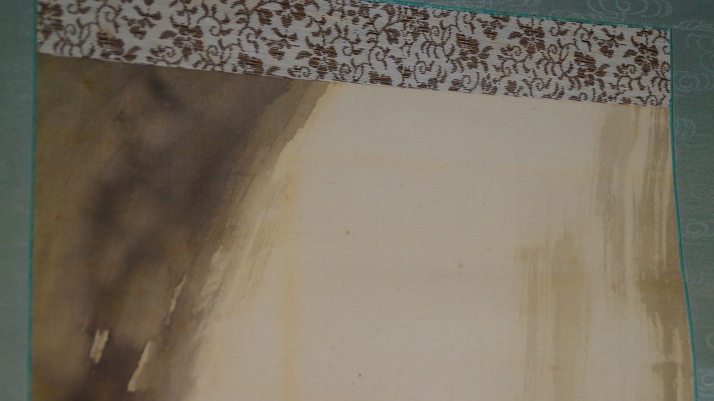 Detail of the patterned silk mounting of the kakemono