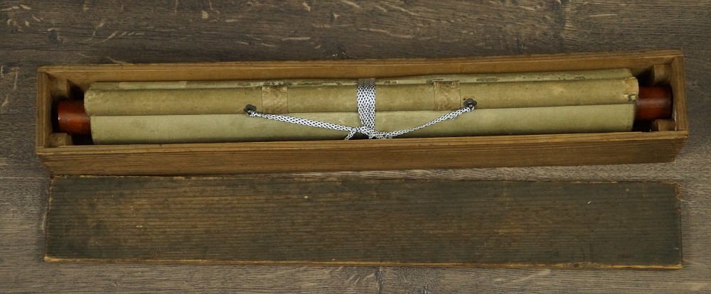 The Rolled Up Kakemono Tied with Cord Lying in the Opened Storage Box
