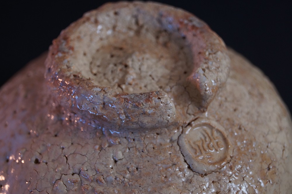 Close-up of the foot with stamped potter's mark