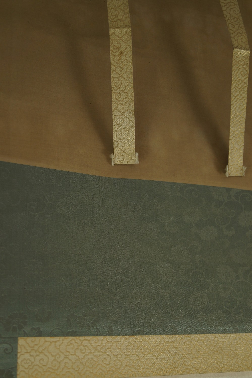 Mounting Brocade Fabric with Tying Ribbons Close-Up