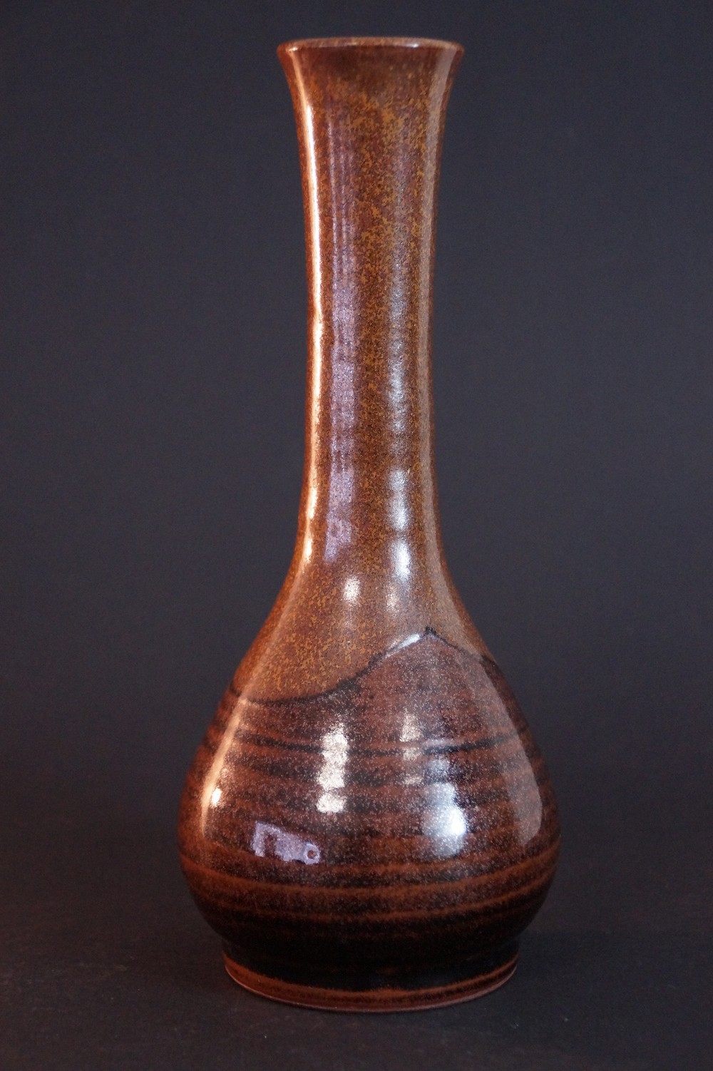 Side view of the Tanba vase with iridescent reddish-brown ash glaze