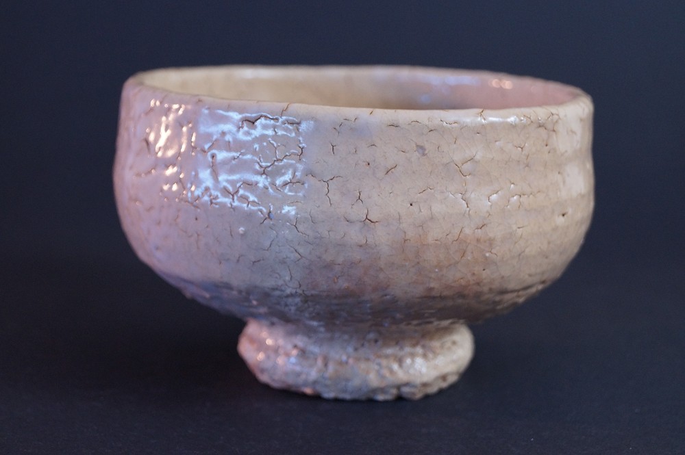 Front view of the handcrafted Hagi ware tea bowl with crackled glaze