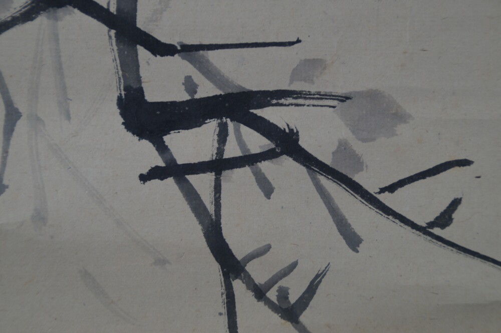 Close-up of the bare branching twigs without leaves in the hanging scroll Raven on a Bare Branch by Watanabe Ando