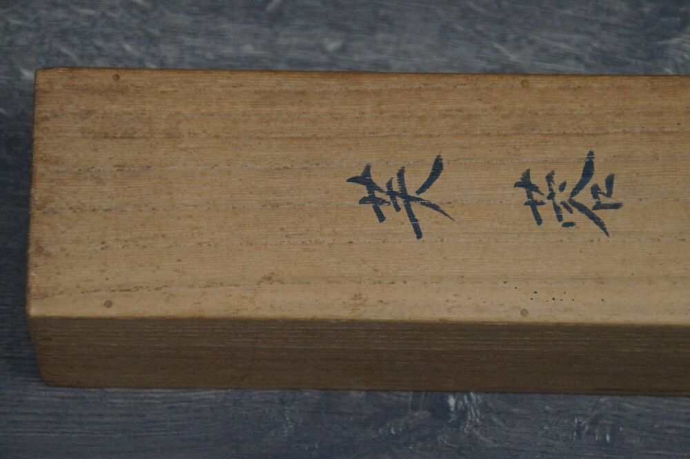 Detail view of the calligraphy inscription on the side of the storage box of the hanging scroll Hibiscus Flowers and Grasshopper