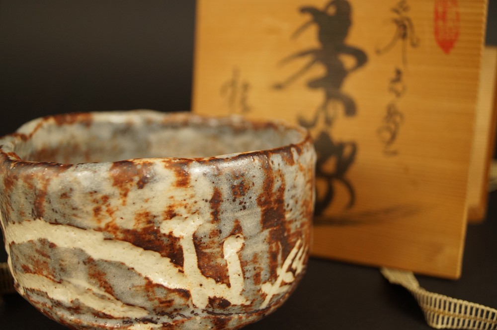 Shino Ware Tea Bowl with Storage Box in the Background Front View with Storage Box