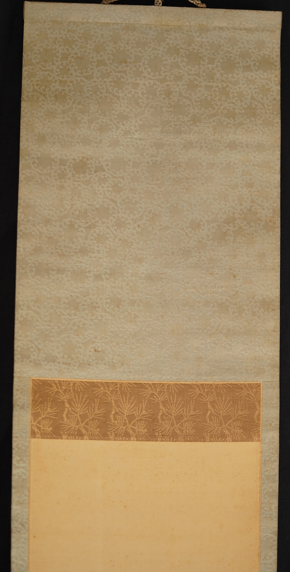 Detail View of the Cream-Colored Silk Mounting with Vine Pattern and Pine Needle Band of the Kakemono Songbird on Blossoming Plum Tree