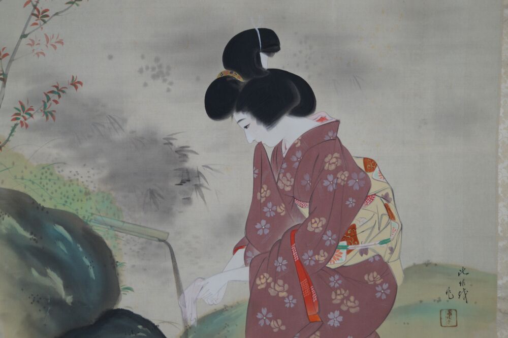 Further close-up of hand and white cloth at the bamboo water spout in the kakemono Lady in Kimono at Garden Pond