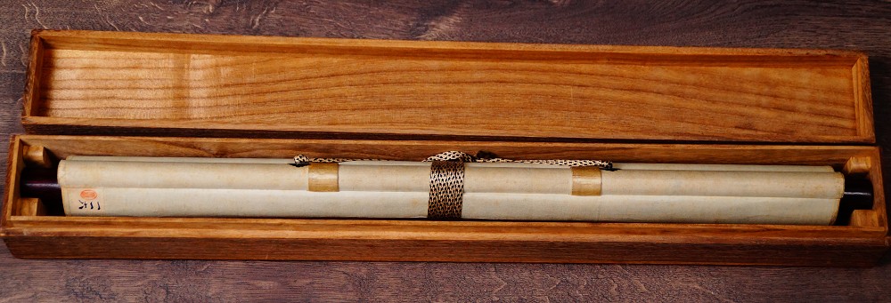 Rolled up Kakemono Spring Awakening, tied with cord, Two Birds on a Blossoming Cherry Branch in the opened storage box