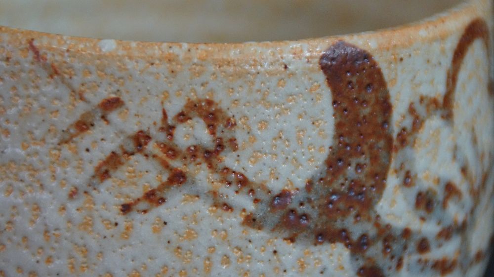 Close-Up of the Rust-Red Brush Motif on the Rim of the Chawan of Shino Ware