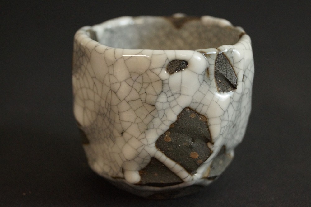 Shino sake cup with crackled white glaze front view