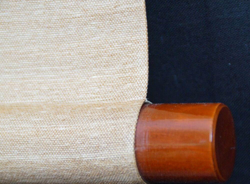 Detail view of the roller end with reddish-brown knob and cream-colored silk of the Hanging Scroll Calligraphy No Concerns