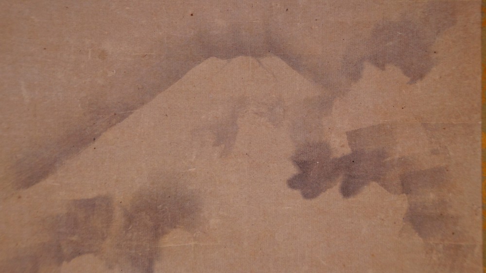 Close-up of Mount Fuji suggested in mist above the ink clouds