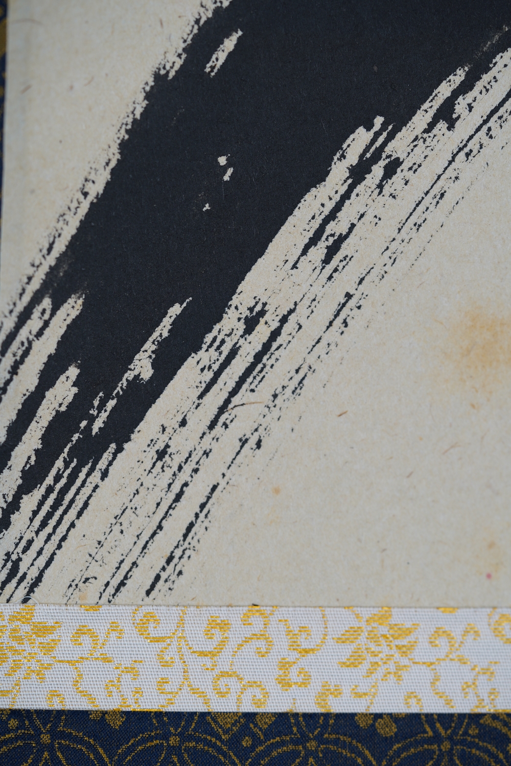 Close-up of the ink texture at the mounting edge of the hanging scroll Daruma in Ink