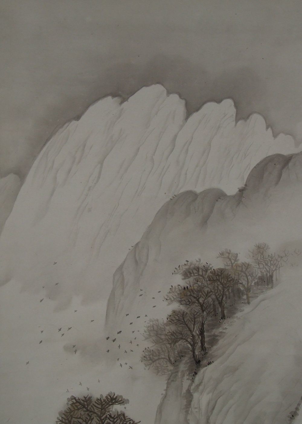 Detail view of the flock of birds and trees on the mountainside in the Kakemono Landscape with Traveler