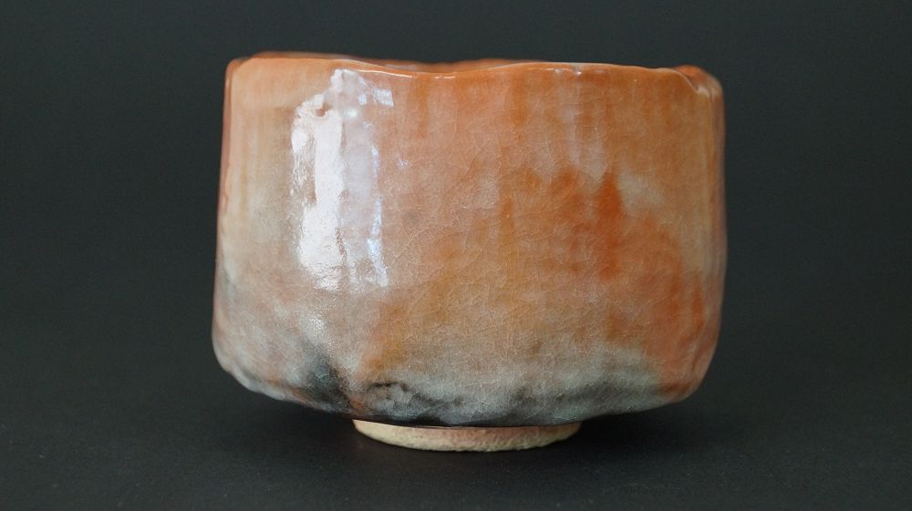 Another view of the chawan tea bowl made of Raku ware with greenish-black discoloration at the foot