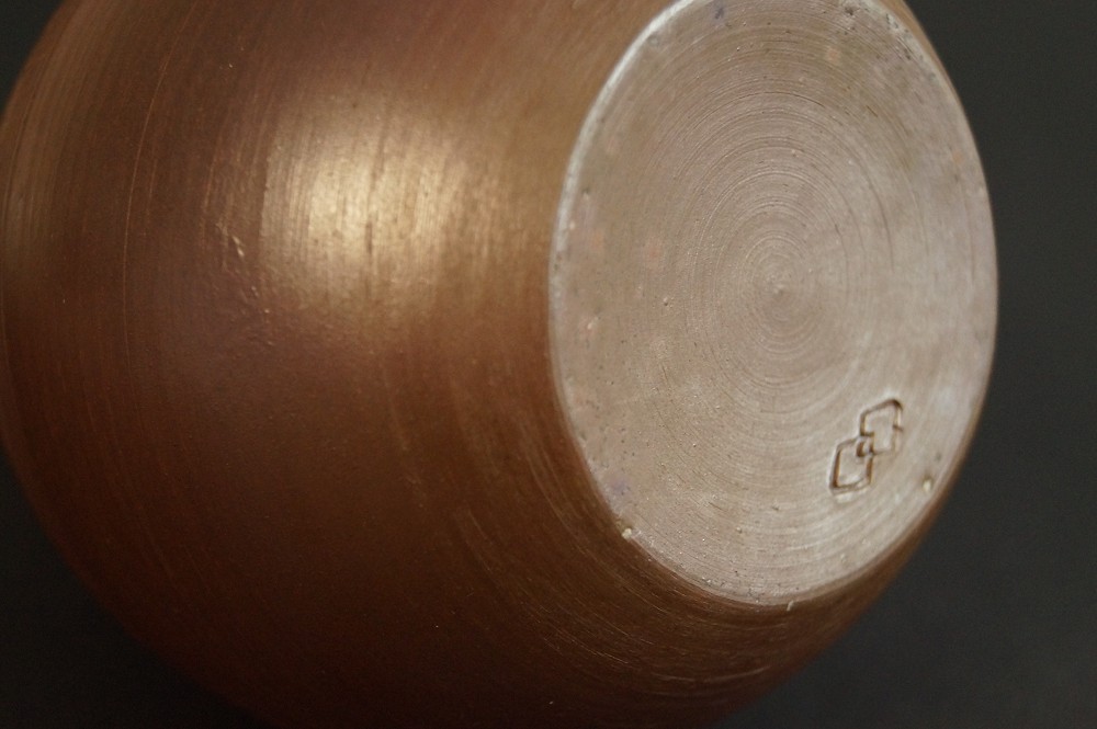 Base of the vase with stamped potter's mark base close-up