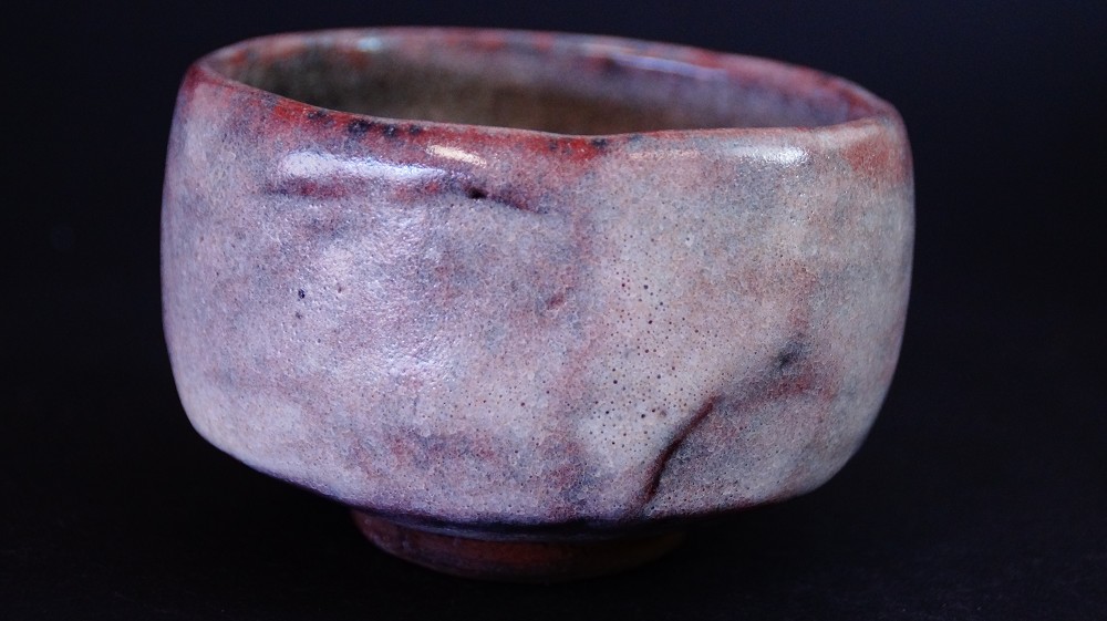 Further side view of the chawan made of Ohi ware with reddish-brown glaze by Kaihatsu Bunmei