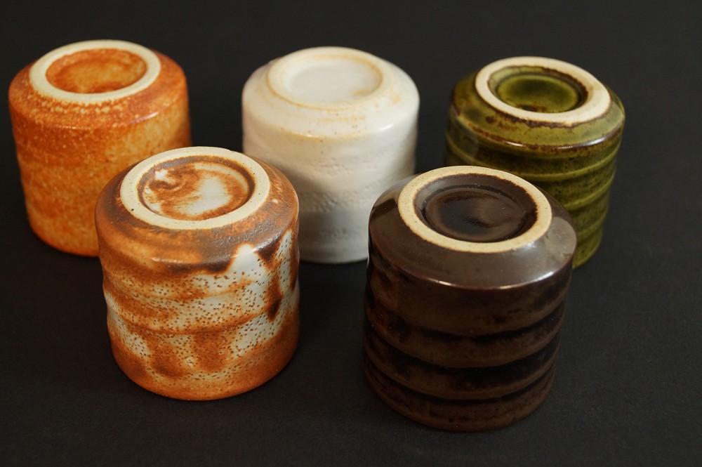 Five inverted sake cups showing the different foot rings Set Foot Close-Up