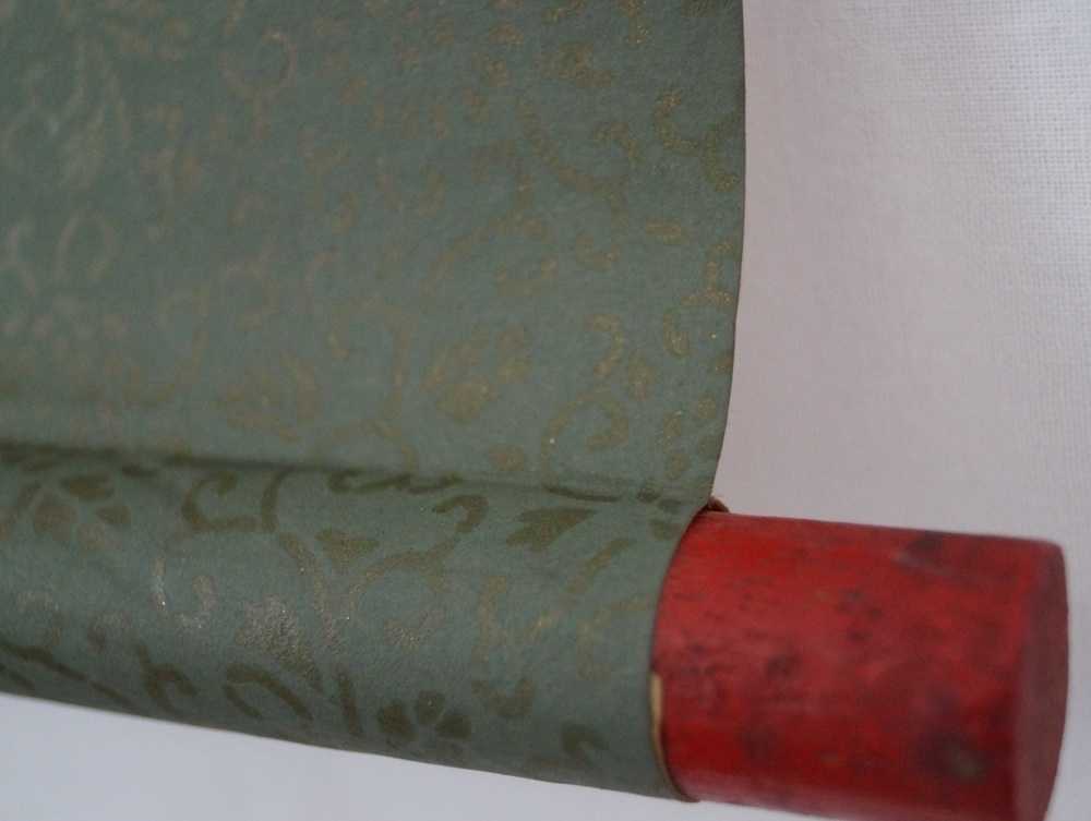 The 13 buddhas close-up of the red scroll end scroll detail