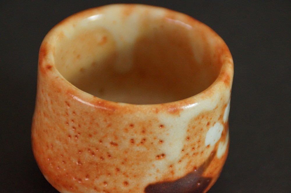Close-up of the crackled Shino glaze on the inside of the guinomi
