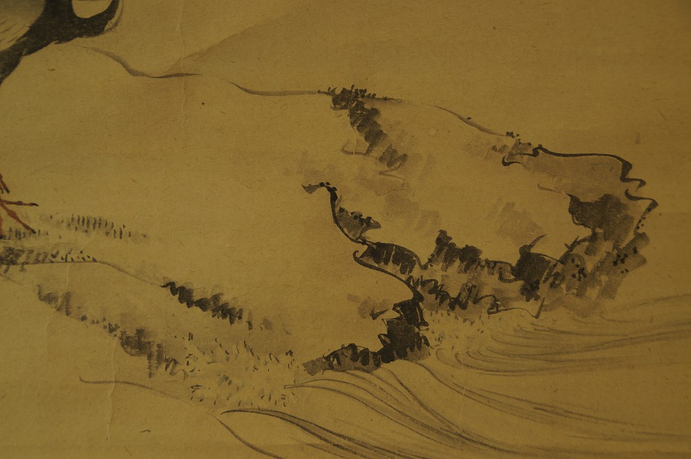 Close-up of the ink rocks and rolling waves on the shore