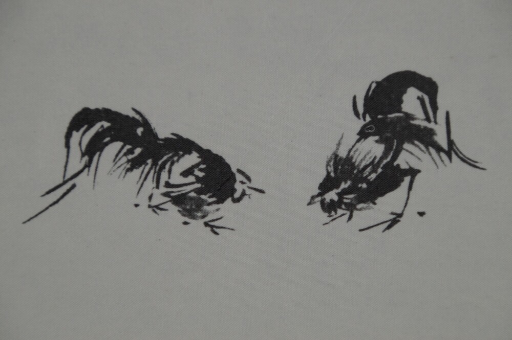 Extreme close-up of the two fighting roosters in the Hotei scroll of the triptych after Miyamoto Musashi