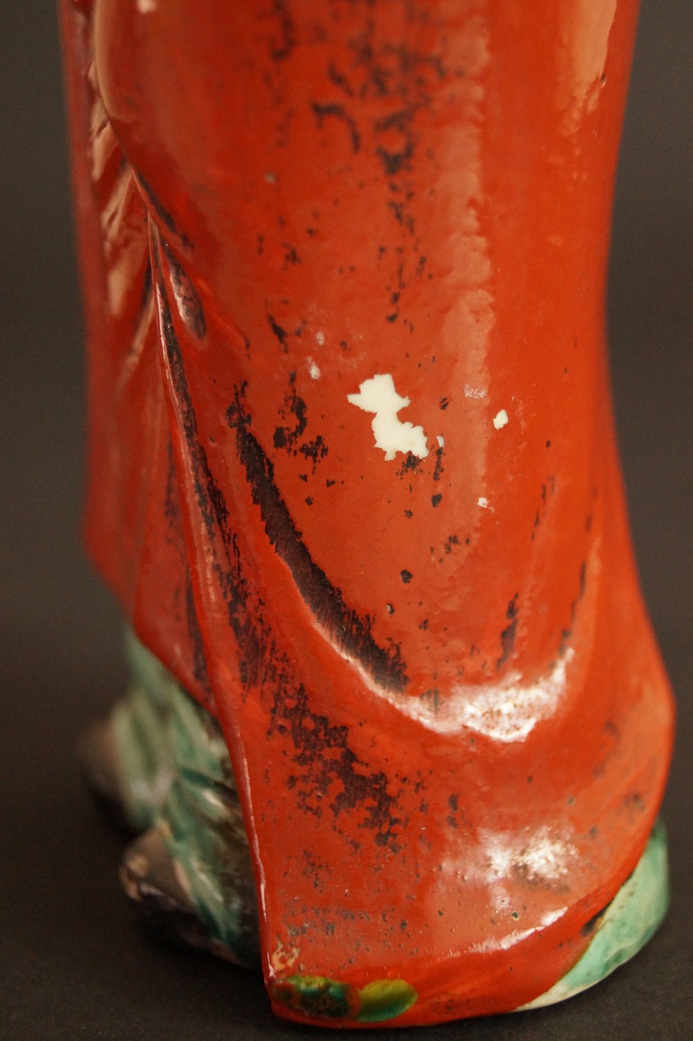 Bodhidharma Daruma Figure Made of Red Kutani Porcelain Close-Up of the Red Glaze with Signs of Aging Glaze Close-Up