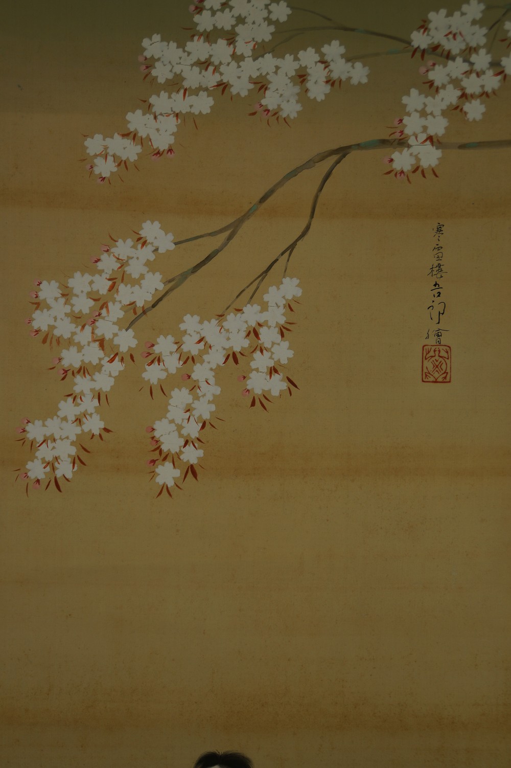 Close-up of the sakura branch with signature and red artist's seal