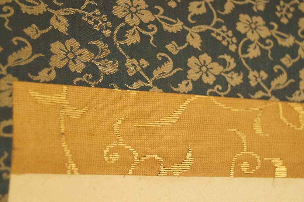 Blue brocade mounting with golden floral pattern mounting detail 2