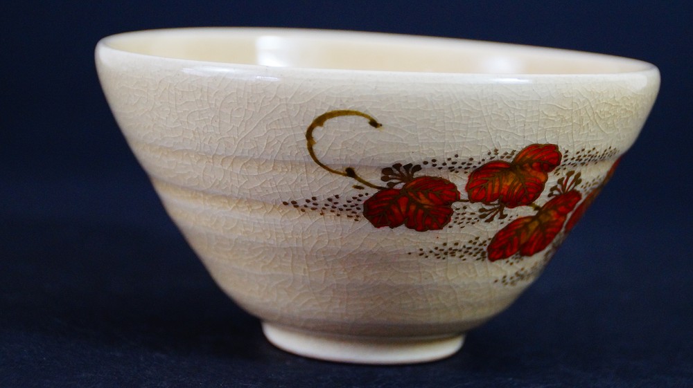 Another side view of the chawan made of Satsuma ware by Gyokusen Nozaki with the maple leaf motif from a different angle