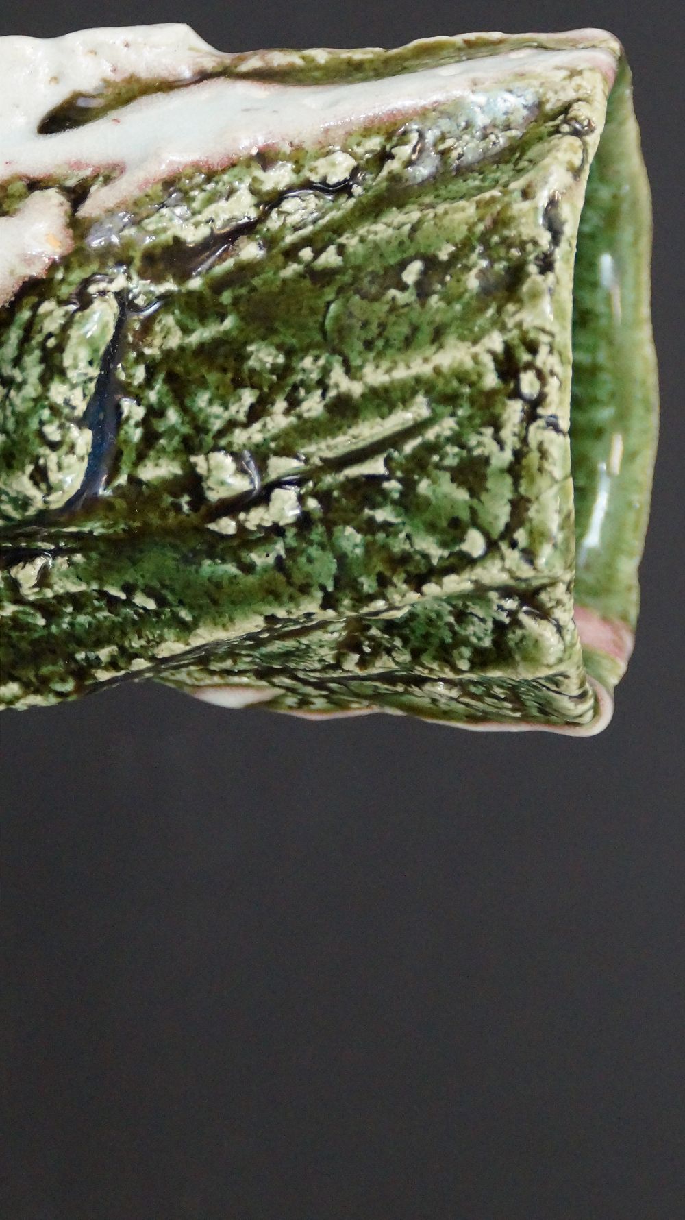 Close-up of the rim with textured green glaze of the yunomi tea bowl made of Oribe ware