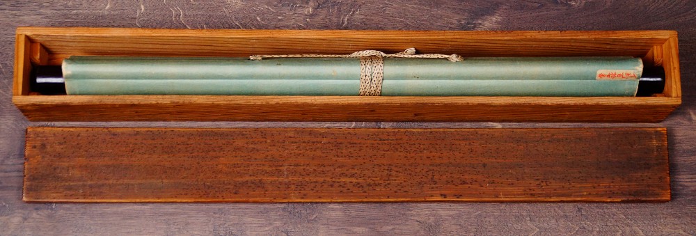 Rolled and cord-tied Kakemono Carp Beneath the Waterfall by Takekawa Tomohiro in the opened storage box