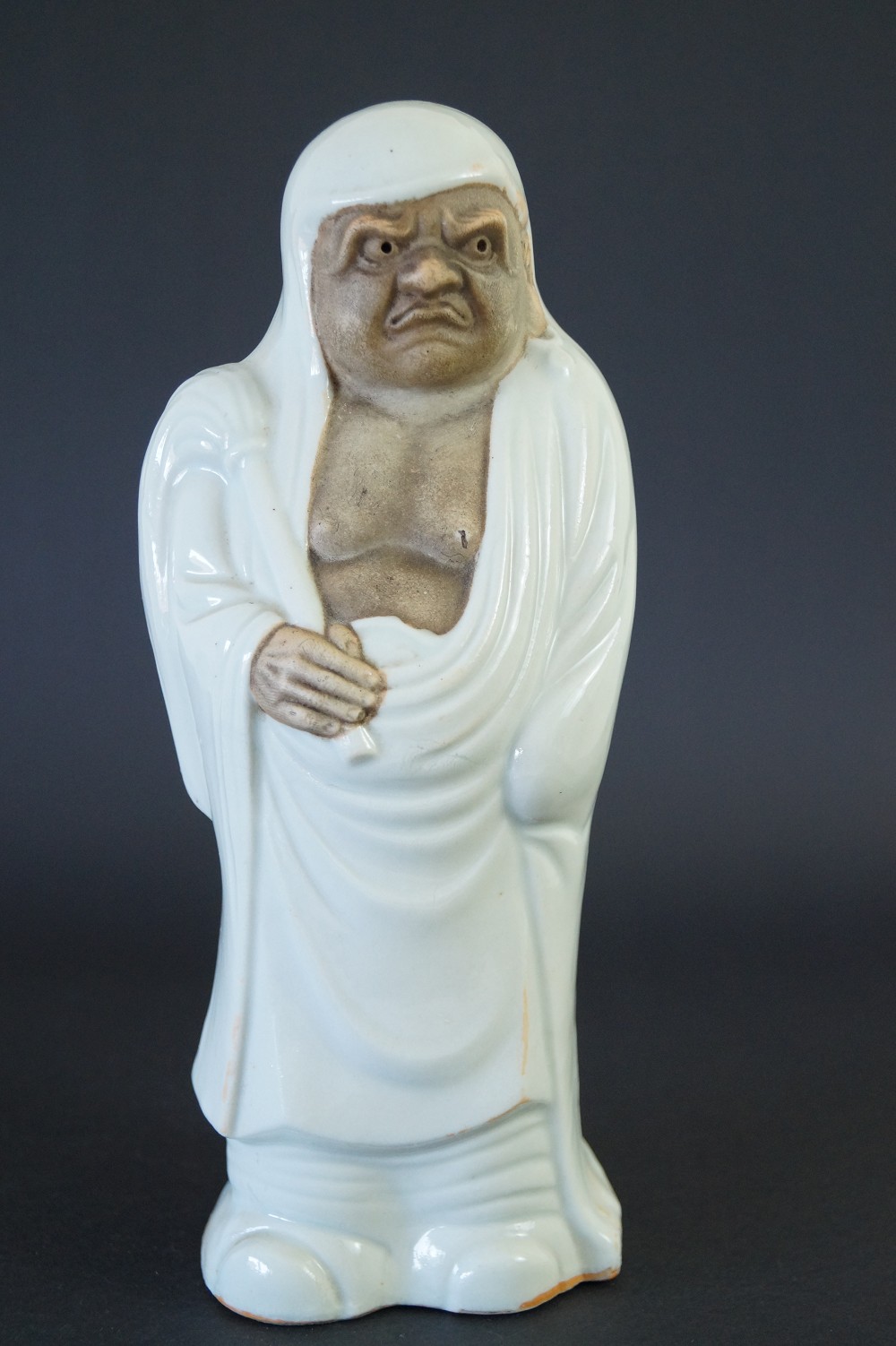 Japanese Bodhidharma Daruma figure made of Kutani porcelain frontal view