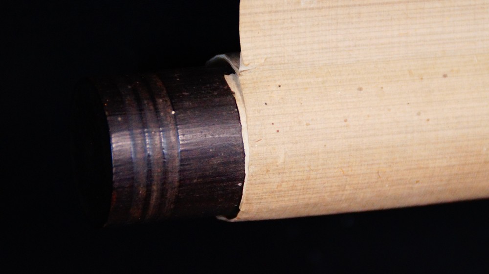 Close-Up of the Dark Scroll End of the Hanging Scroll