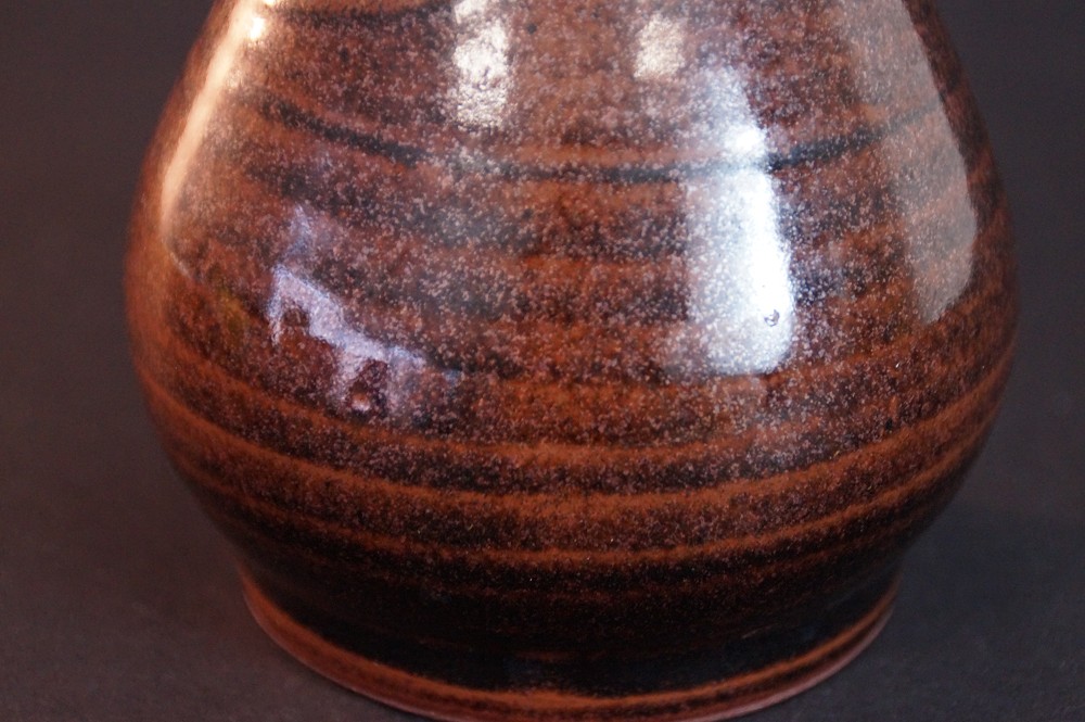Another close-up of the shimmering ash glaze on the bulbous body