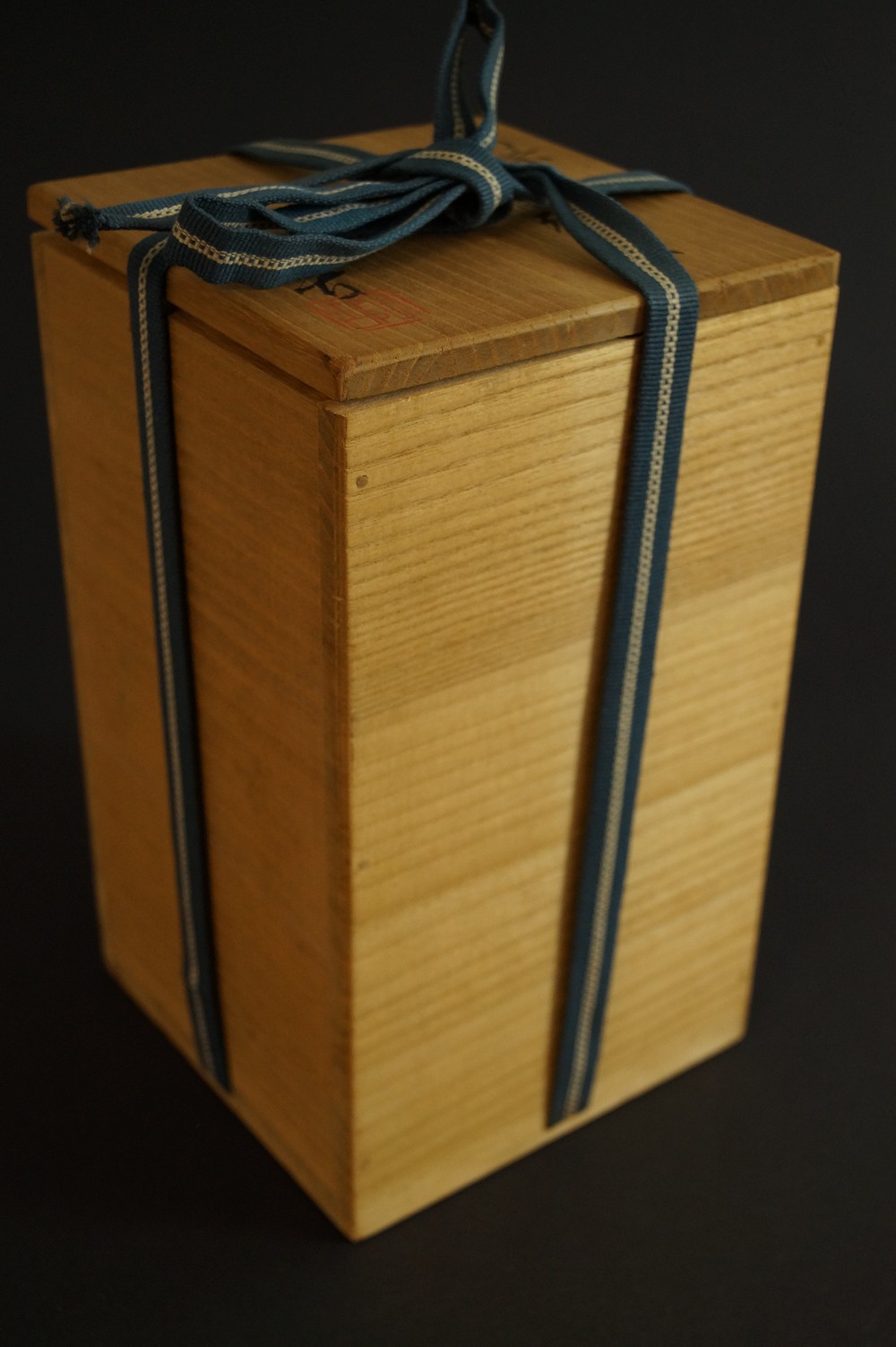 Closed wooden box with tied cord Storage Box with Cord