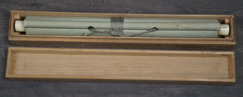 Opened storage box with rolled-up Kakemono Autumn Chrysanthemums