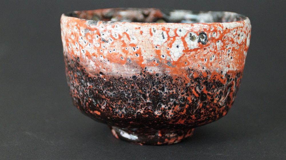 Further view of the Chawan tea bowl made of Raku ware next to the opened storage box