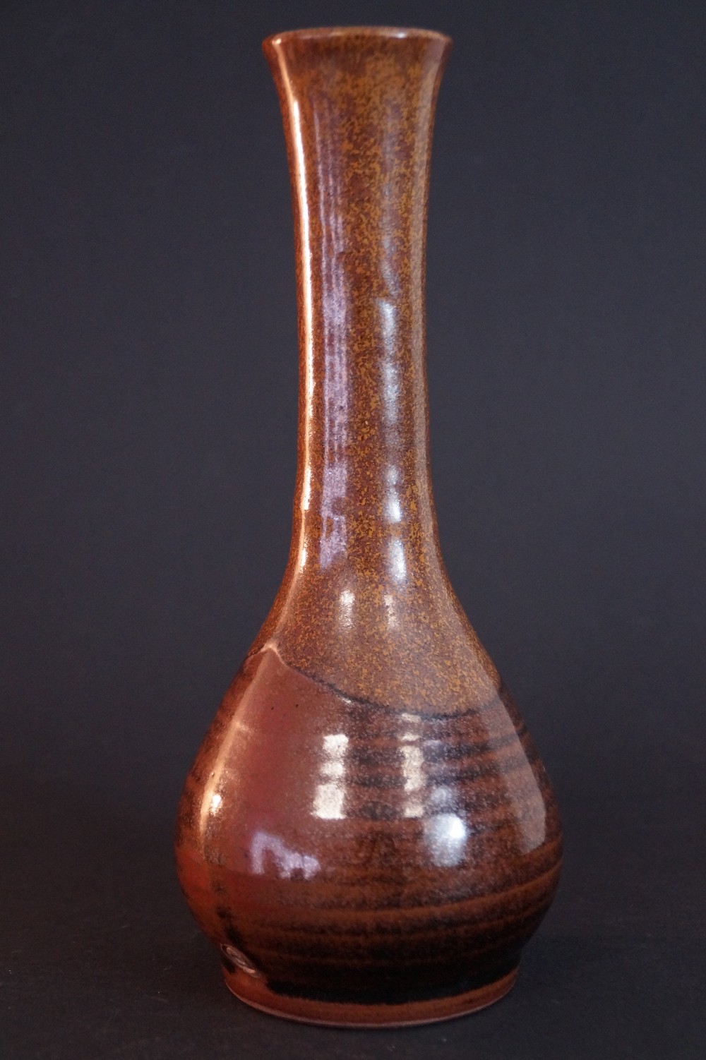 Another side view of the bulbous vase with slender neck