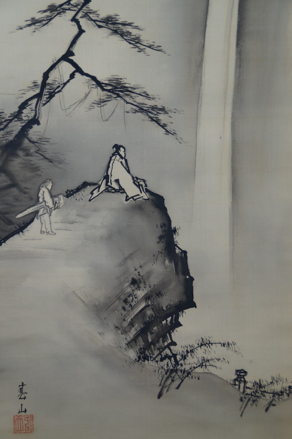 Scholar and servant beneath the pine by the roaring waterfall with artist's signature in the hanging scroll Encounter at the Edge of the Waterfall by Yagioka Shunzan