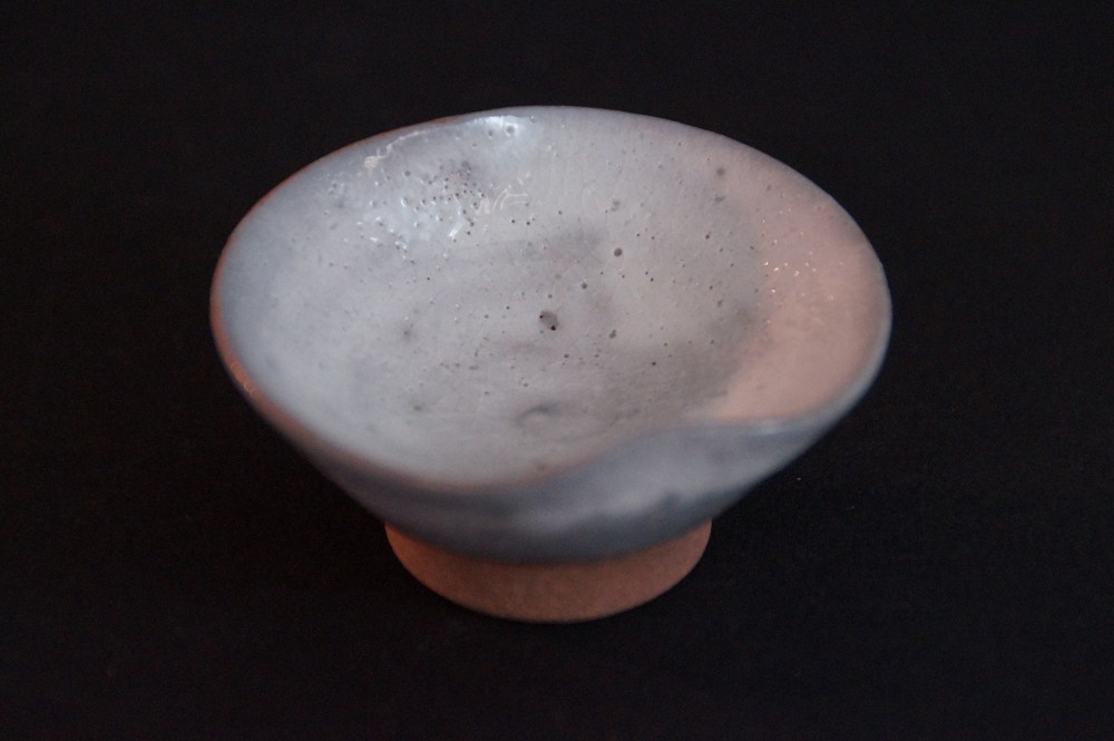Close-up of the interior of the cup with a delicate bluish-gray glaze