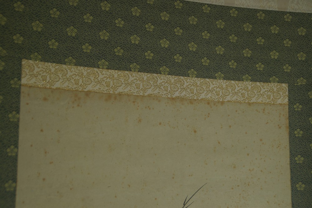 Close-up of the green border with bright floral pattern
