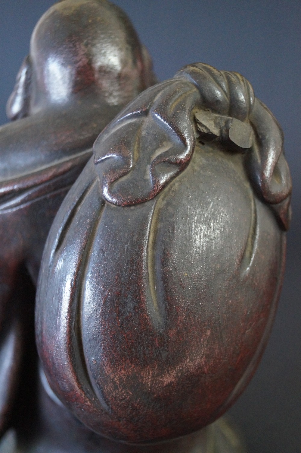 Hotei figure made of Bizen ware sack close-up